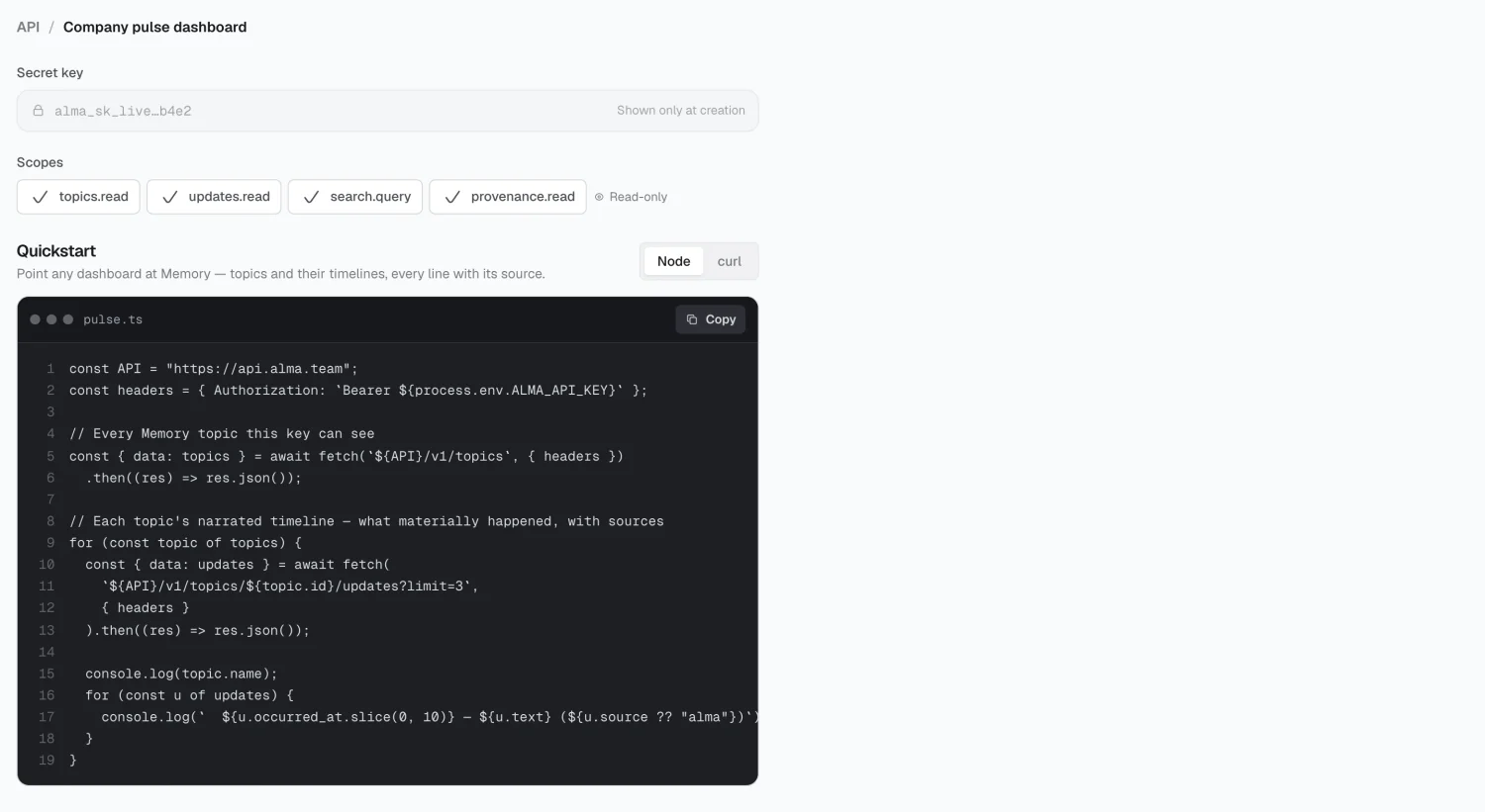 The reveal-once key screen with quickstart snippets